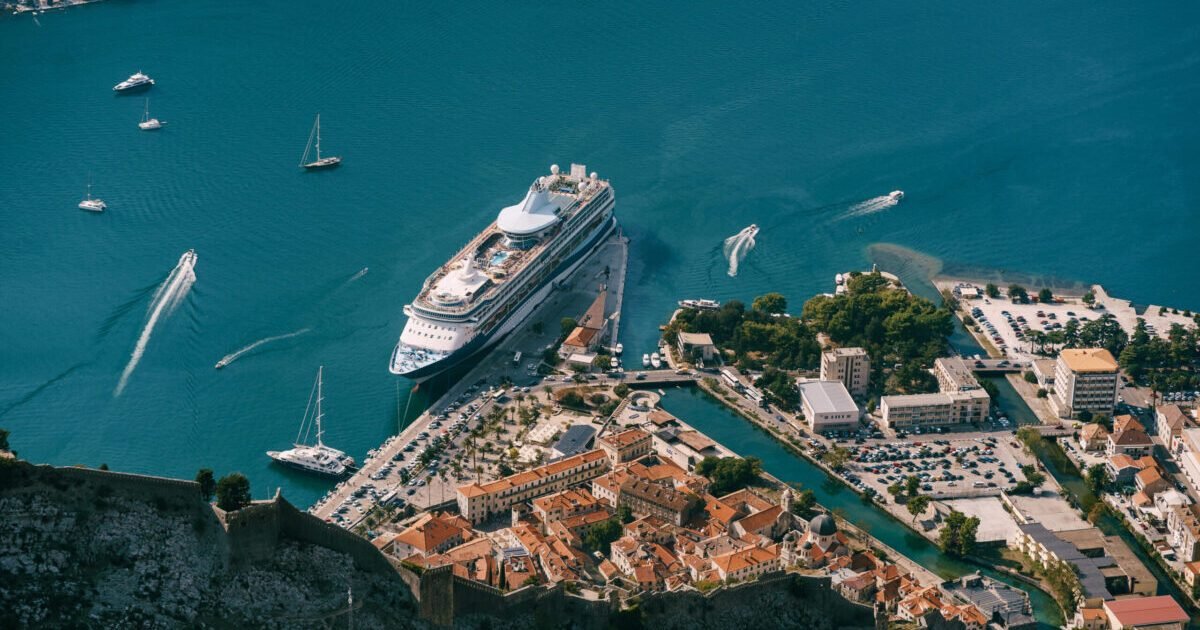 Cruise ship at the pier of the old town of Kotor. View from Mount Lovcen. High quality photo