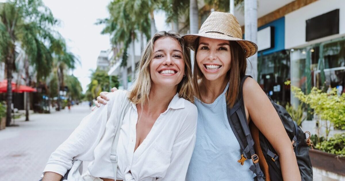 Portrait,Of,Latin,Couple,Of,Women,Tourist,Backpackers,In,Mexico