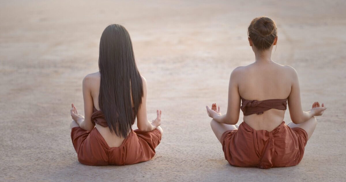 two-women-practicing-meditation-on-a-spacious-grou-2026-01-11-10-32-55-utc